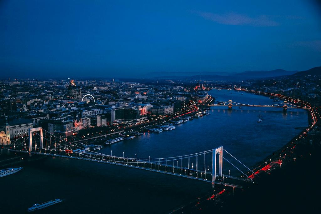 Vibrant street in Barcelona with Gaudí architecture and palm trees