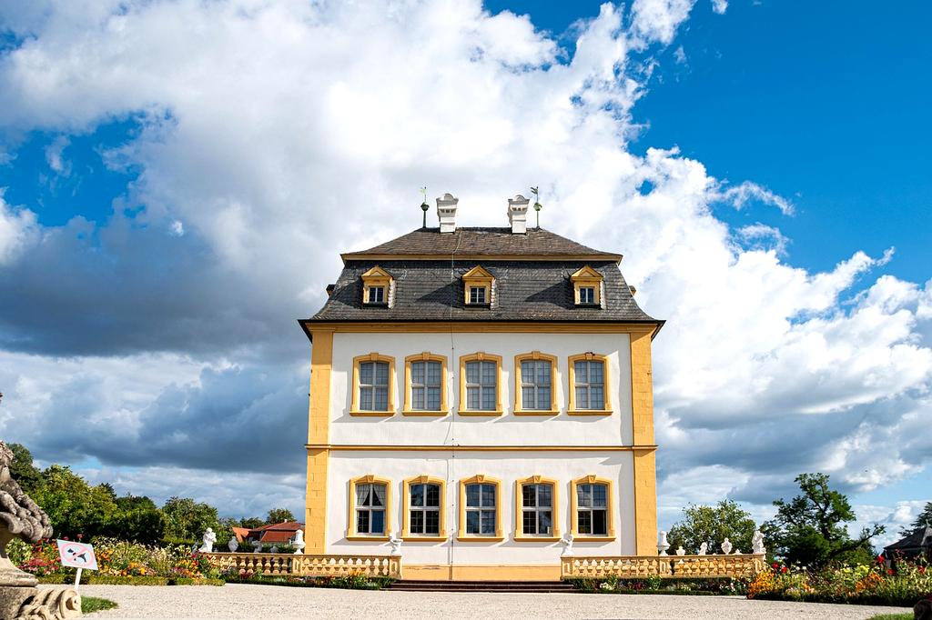 Electric bike sharing station in modern city with green urban landscape